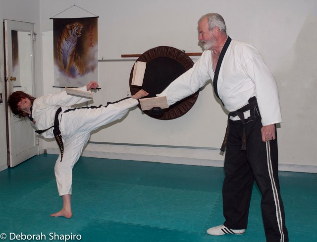 Sasha breaking a board