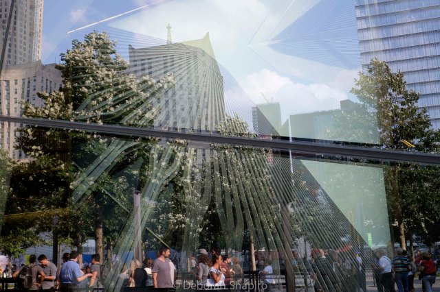 A photograph of the facade of the old World Trade Center reaches for the sky